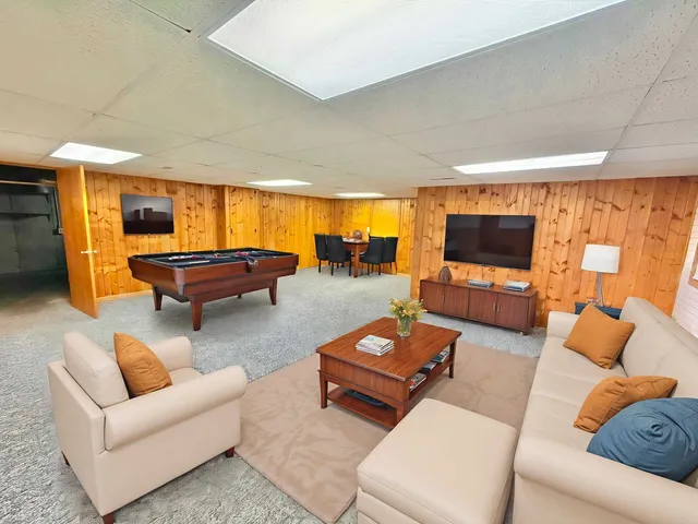 a front view of a house with a yard and fence