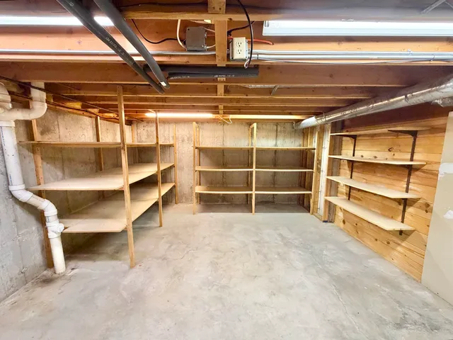 a view of a balcony with wooden floor and fence
