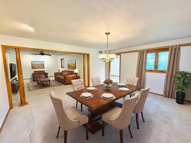 a view of a dining room with furniture window and outside view