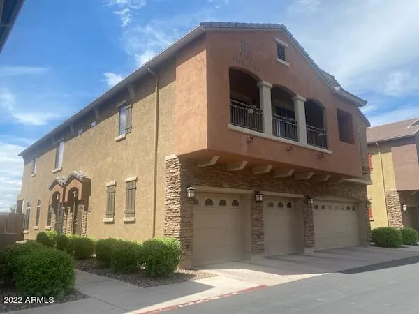 a front view of a house with a garage