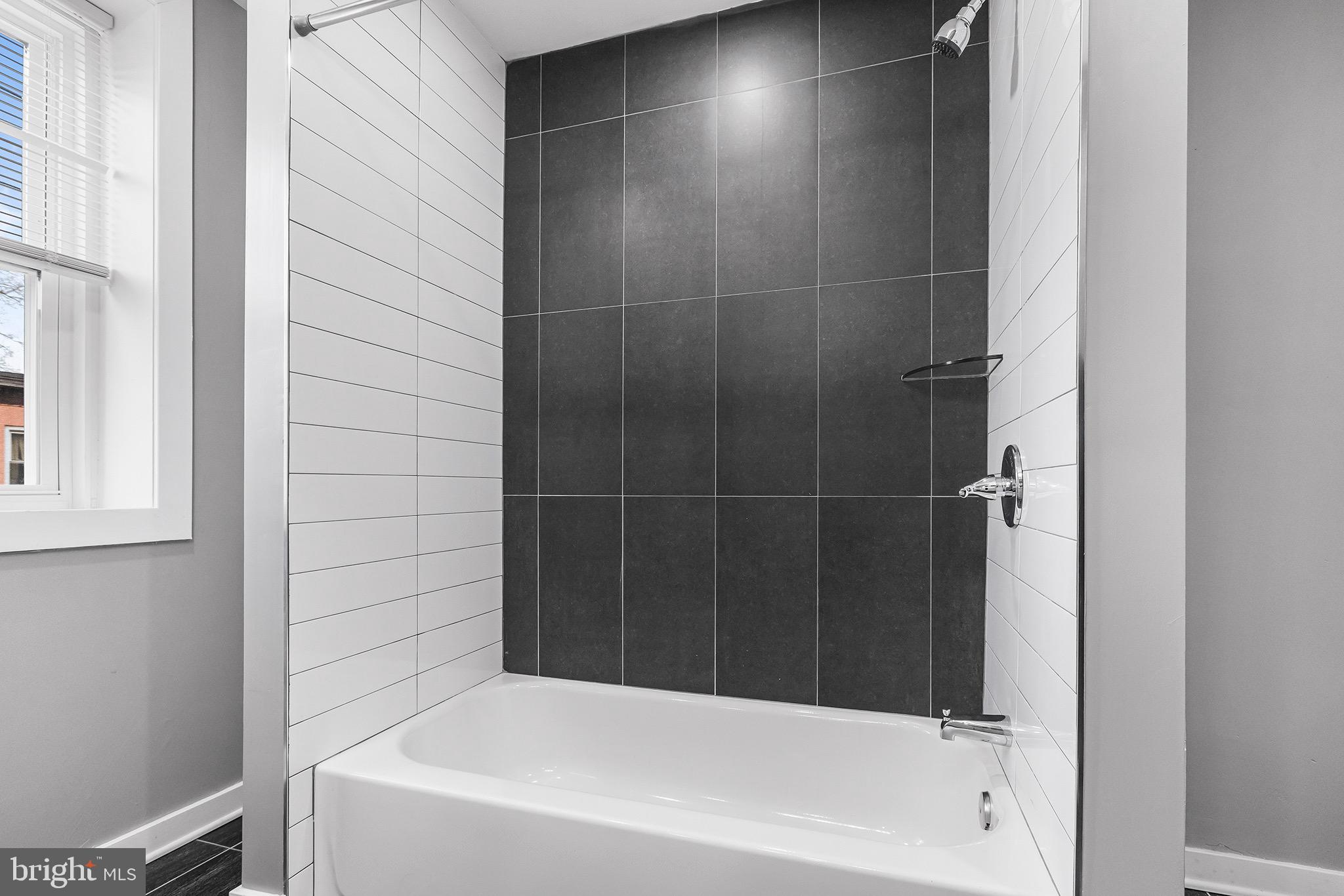 2125 North 20th Street, Unit 2 Philadelphia, PA 19121 - Photo 14 of 20 a bathroom with a bathtub
