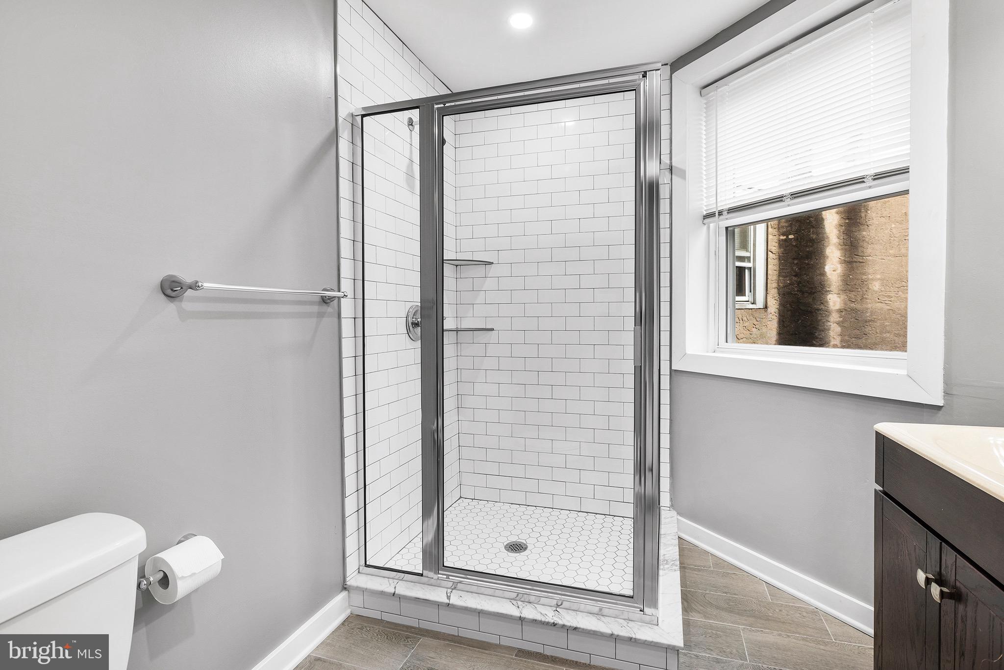 2125 North 20th Street, Unit 2 Philadelphia, PA 19121 - Photo 5 of 20 a bathroom with a shower and toilet