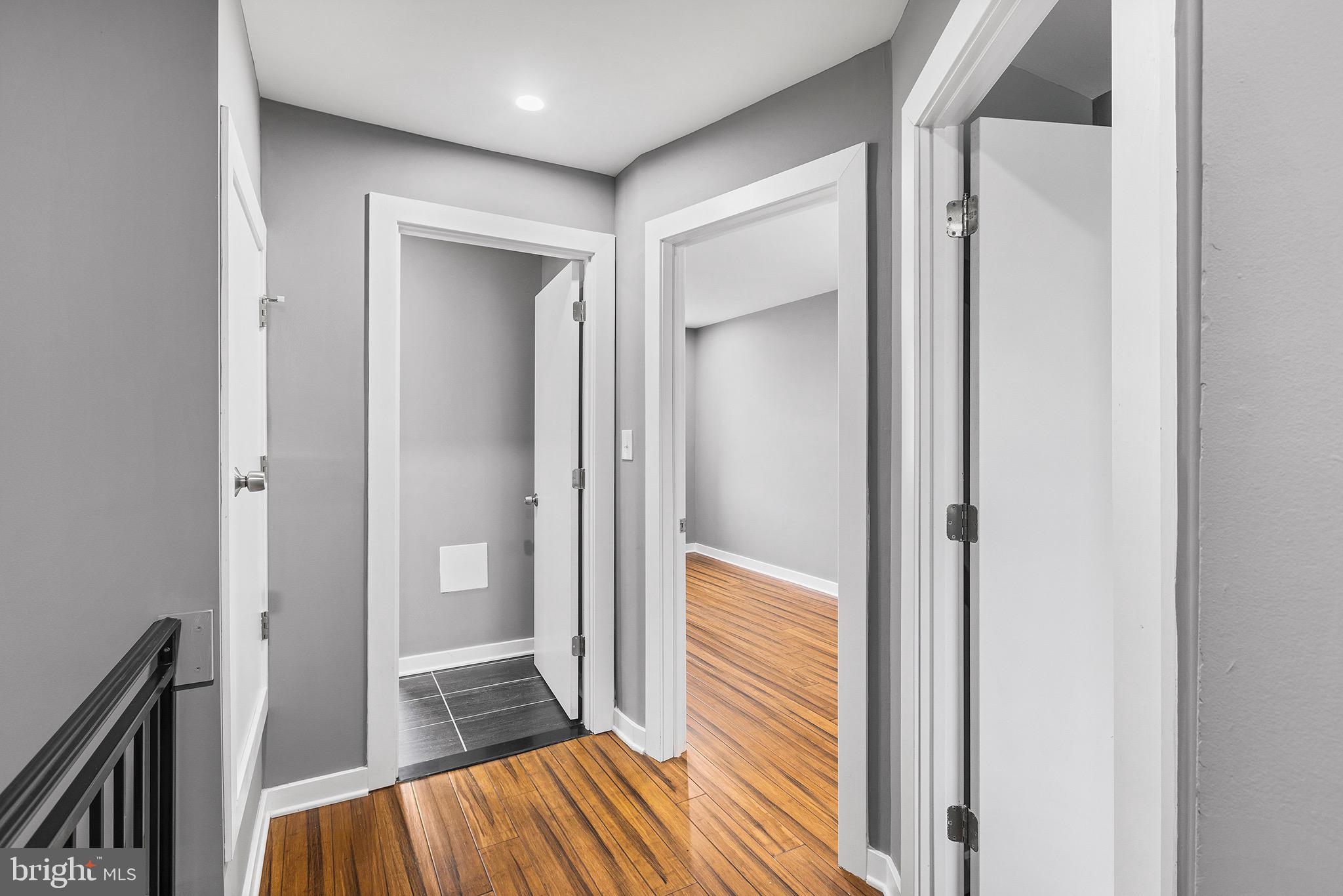 2125 North 20th Street, Unit 2 Philadelphia, PA 19121 - Photo 10 of 20 a view of a hallway with wooden floor and staircase
