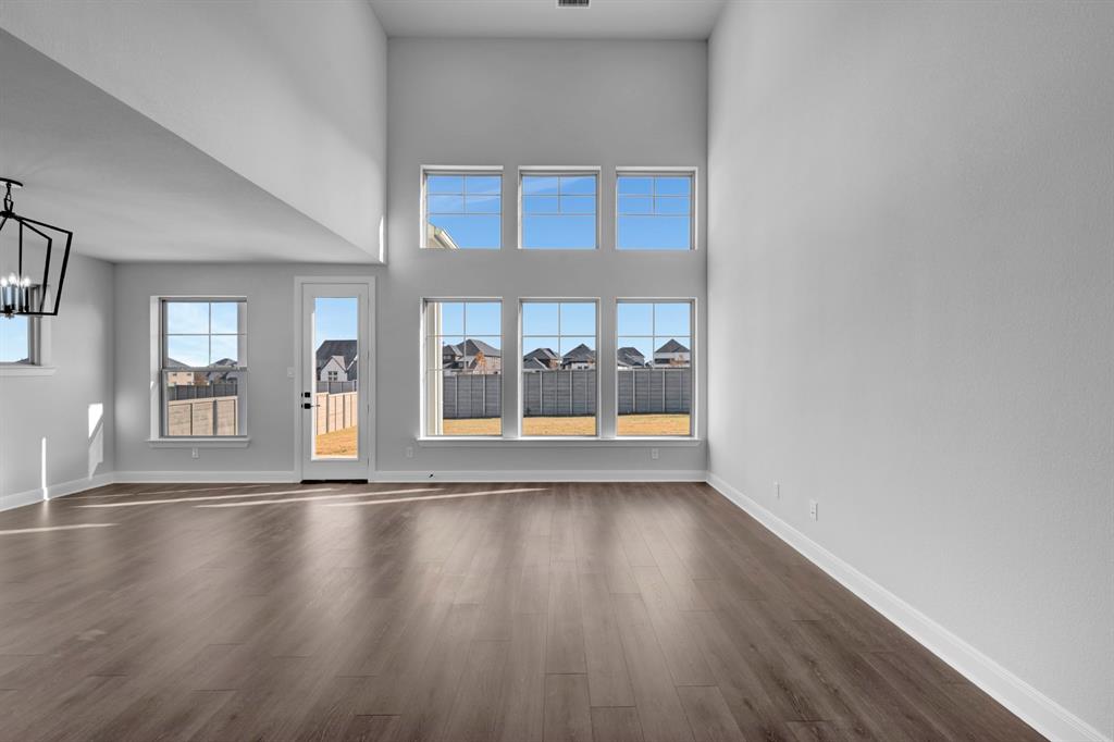 9004 Chestnut Lane Justin, TX 76247 - Photo 34 of 40 a view of room with window and wooden floor
