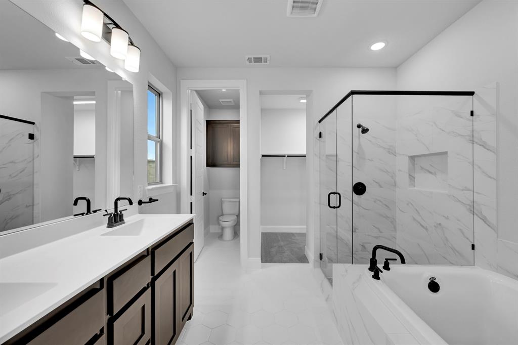 9004 Chestnut Lane Justin, TX 76247 - Photo 38 of 40 a bathroom with a sink and a tub