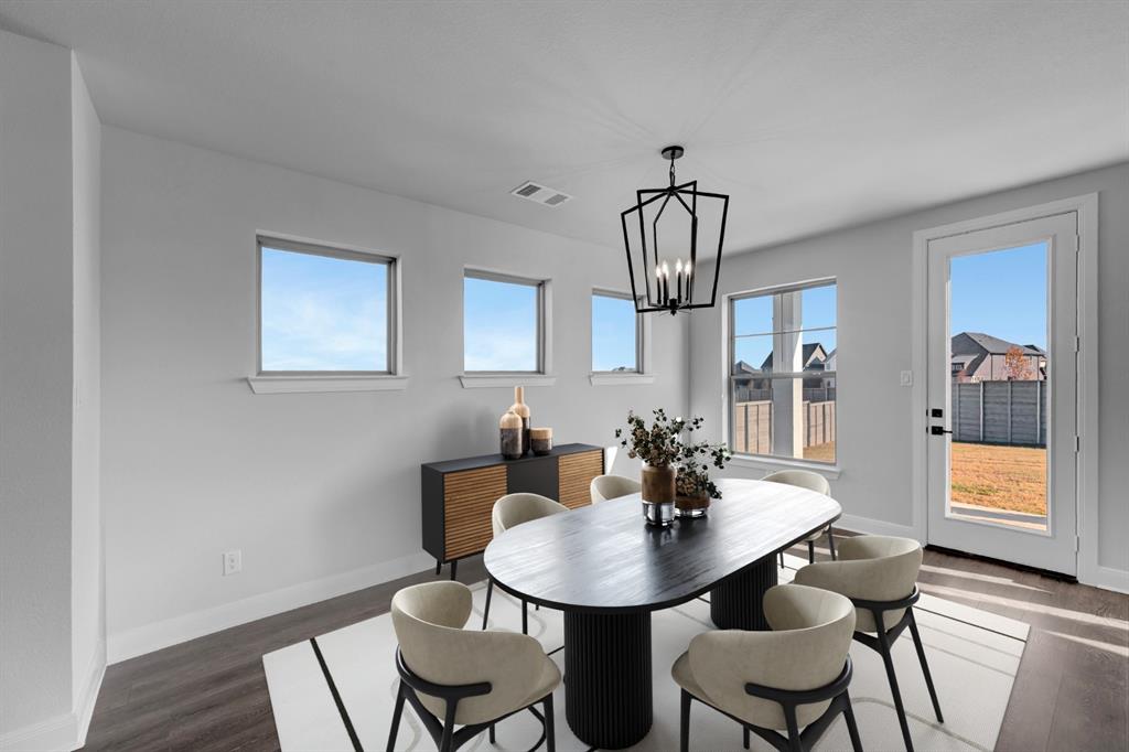 9004 Chestnut Lane Justin, TX 76247 - Photo 8 of 40 a view of a a dining room with furniture window and wooden floor