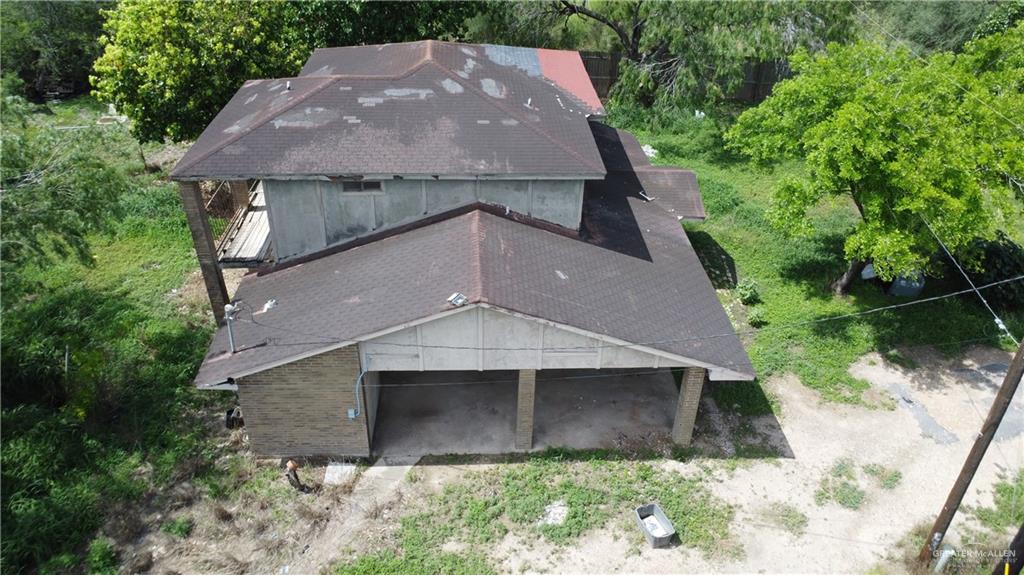 1524 West Hi Line Road Pharr, TX 78577 - Photo 24 of 34 an aerial view of house with yard and trees in the background