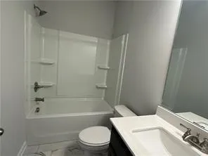 a bathroom with a sink a toilet and a bathtub