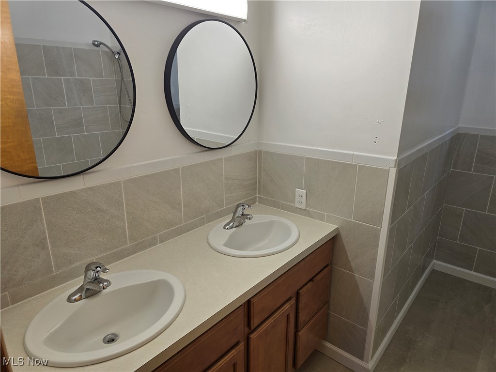 67 Moore Road Akron, OH 44319 - Photo 11 of 15 Bathroom with vanity and backsplash