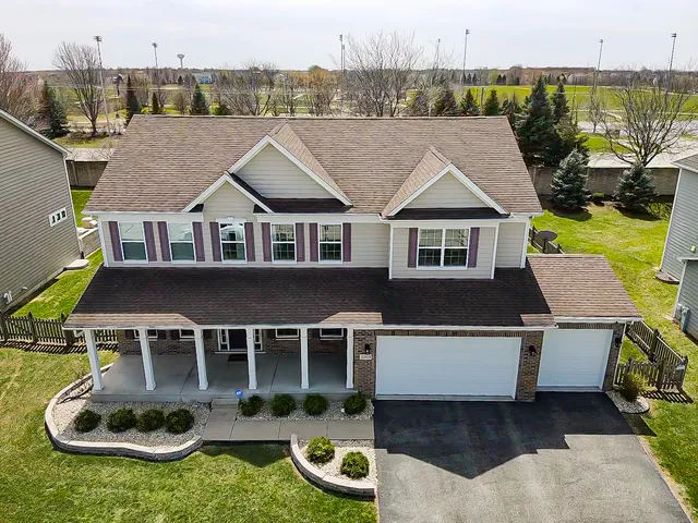 an aerial view of a house with swimming pool