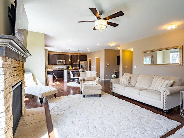 a living room with furniture and a fireplace