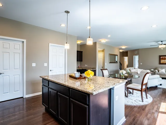 a kitchen with a counter space dining table and chairs