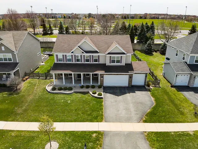 an aerial view of a house with swimming pool