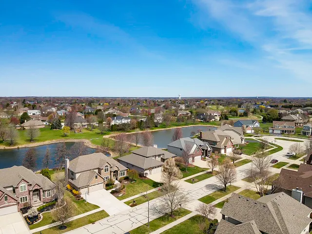 an aerial view of a house with outdoor space