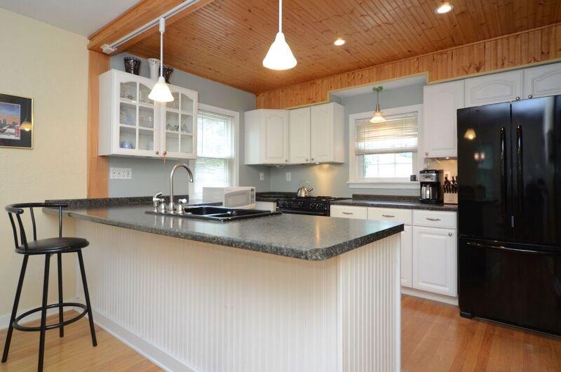 302 Lindsay Road Carnegie, PA 15106 - Photo 11 of 21 Updated kitchen with white wood cabinets Island Pine ceiling Recessed and track lighting