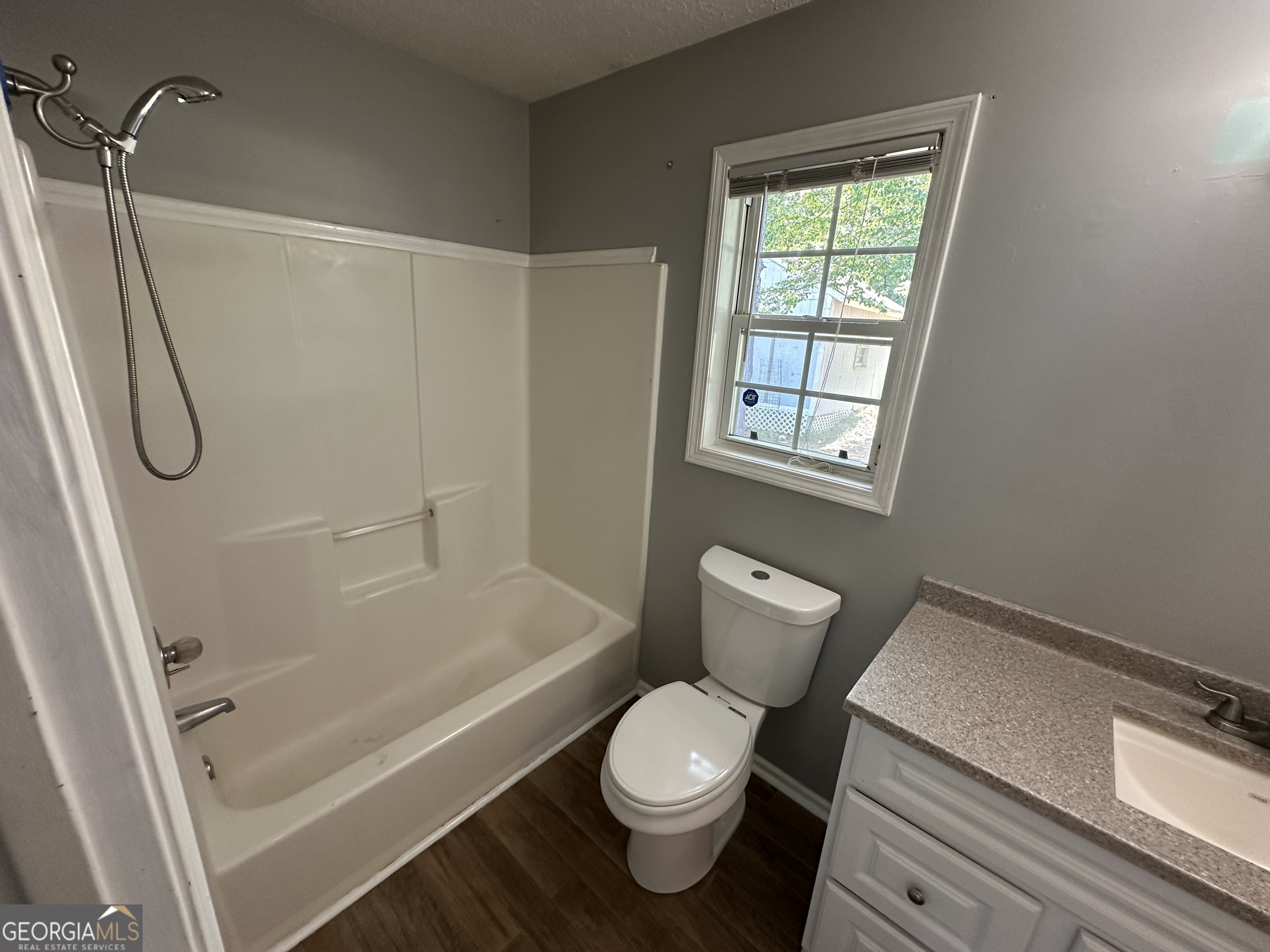 384 Sam Brown Boulevard Commerce, GA 30529 - Photo 14 of 25 a bathroom with a toilet and a shower