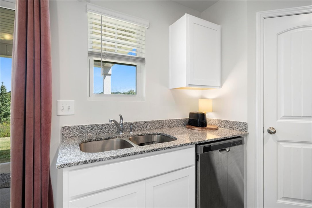 117 Adger Road Pendleton, SC 29670 - Photo 12 of 36 This bright utility space combines practicality and style with modern amenities.