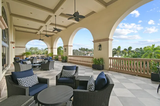 a outdoor living space with furniture and a floor to ceiling window