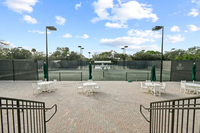 a view of a deck with a table and chairs