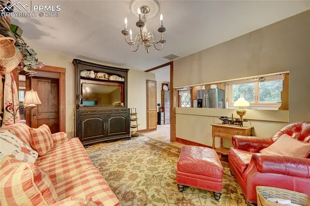 a bedroom with furniture and flat screen tv
