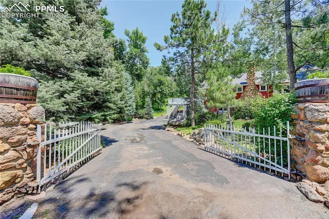 a view of a garden with wooden fence