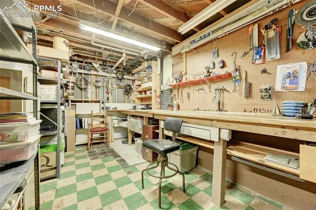 an aerial view of a house with balcony and trees