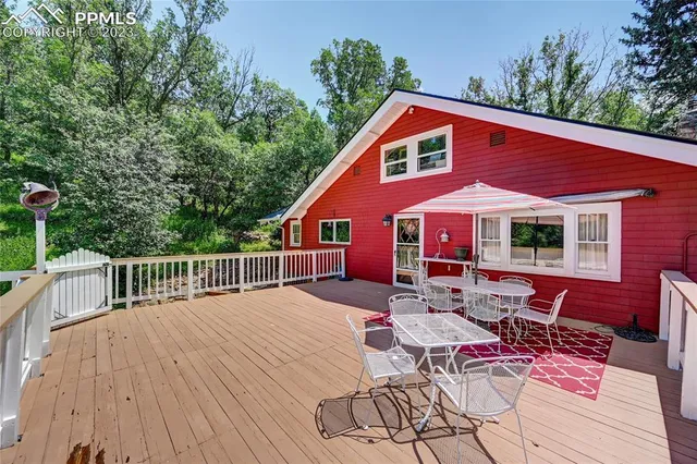 a patio with a table and chairs