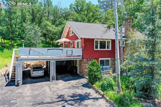 an aerial view of a house with a yard basket ball court and outdoor seating