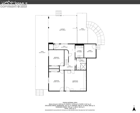 a backyard of a house with yard and outdoor seating