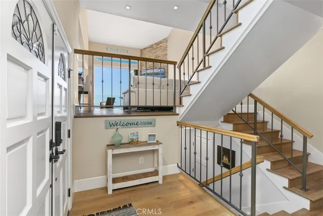 a living room with furniture and a dining table