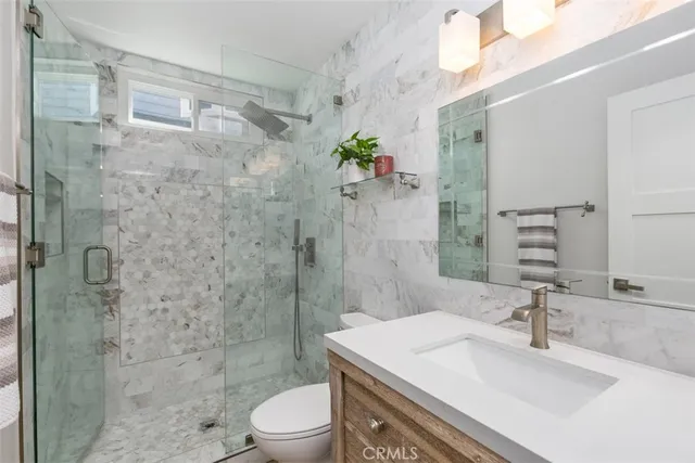 a view of a balcony with couch and wooden floor