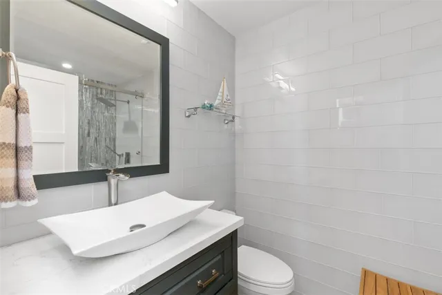 a stove top oven sitting inside of a kitchen