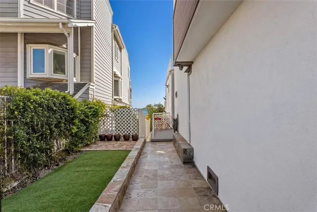 a view of a bedroom with a bench and wooden floor