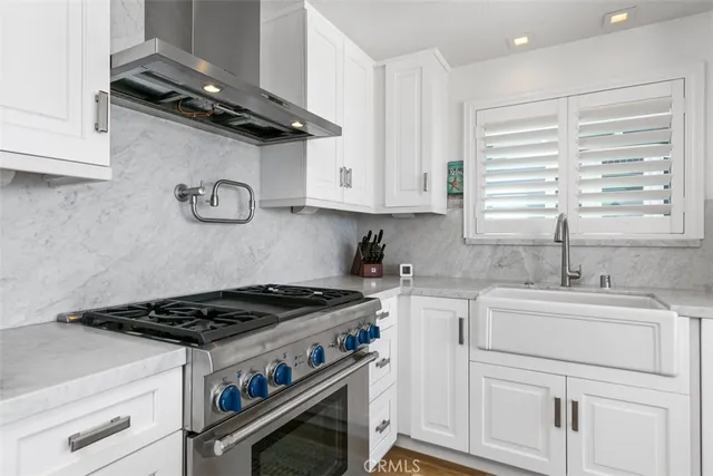 a kitchen with center island table and chairs