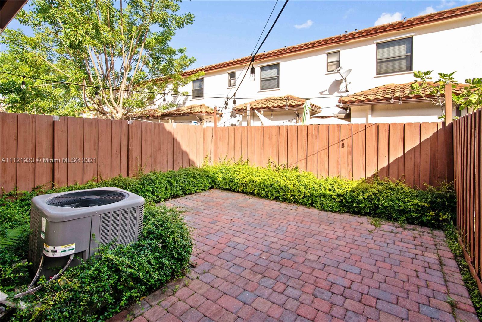 3213 Southeast 5th Court Homestead, FL 33033 - Photo 5 of 19 a view of a backyard with plants and a tree