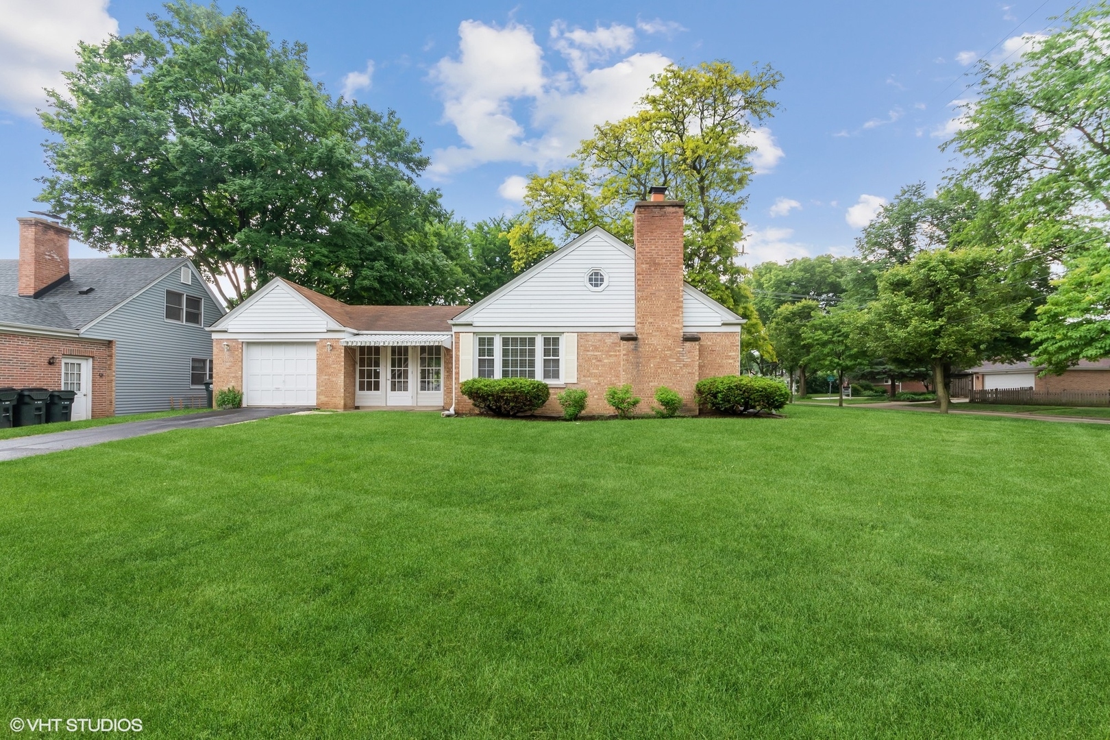 402 Berry Road Barrington, IL 60010 - Photo 16 of 22 a front view of a house with a yard and trees