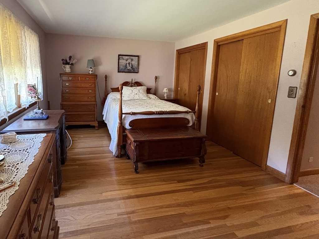 11 Highland Avenue Clinton, MA 01510 - Photo 11 of 25 a bedroom with a bed and a dresser