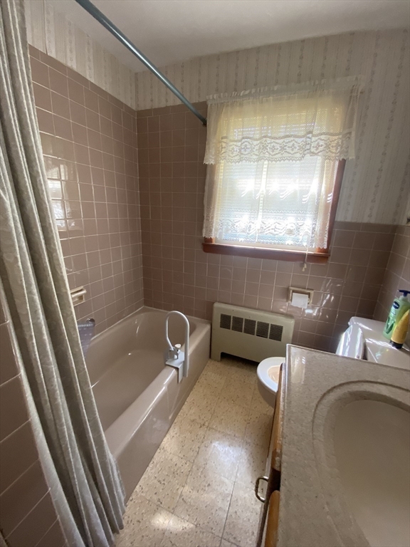11 Highland Avenue Clinton, MA 01510 - Photo 15 of 25 a bathroom with a tub and a sink