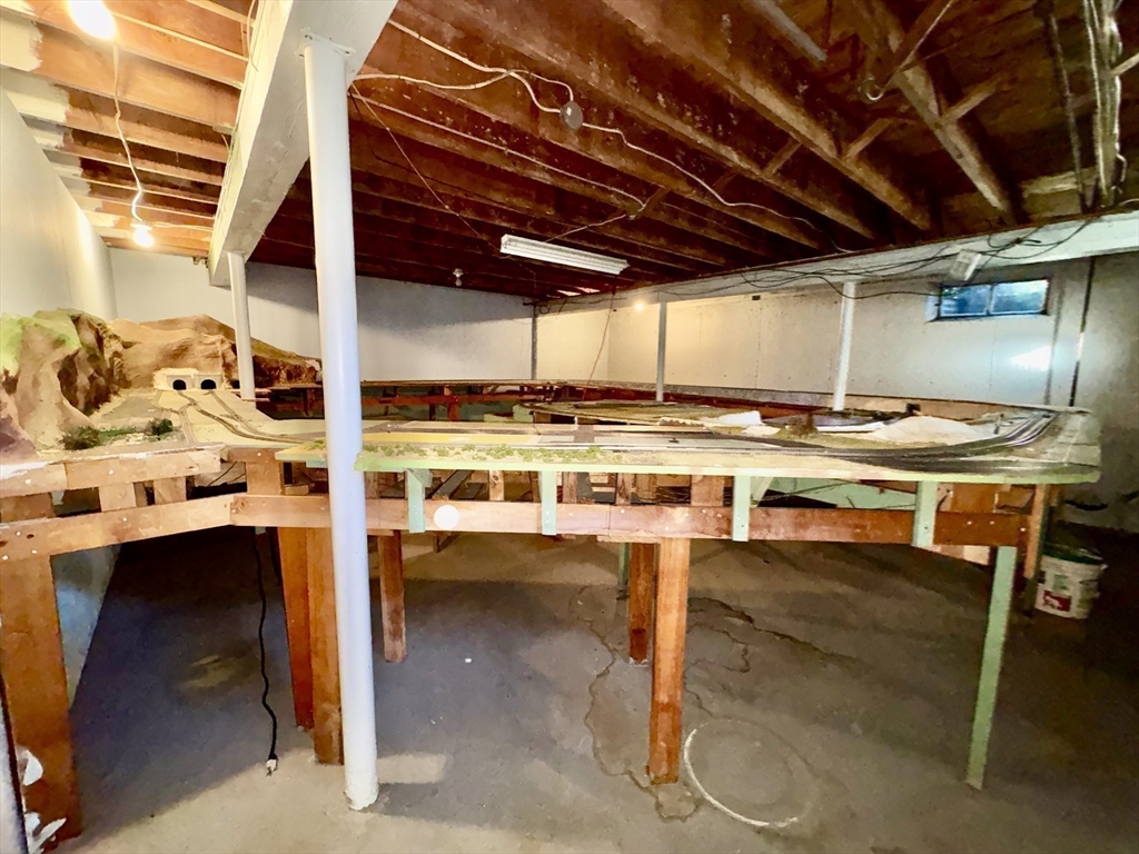 11 Highland Avenue Clinton, MA 01510 - Photo 19 of 25 a room with stainless steel appliances kitchen island a table and chairs in it