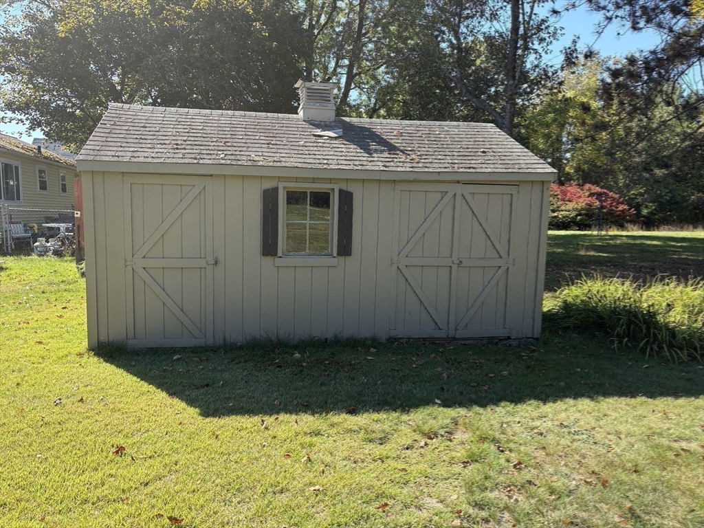 11 Highland Avenue Clinton, MA 01510 - Photo 22 of 25 a view of a backyard with a tub