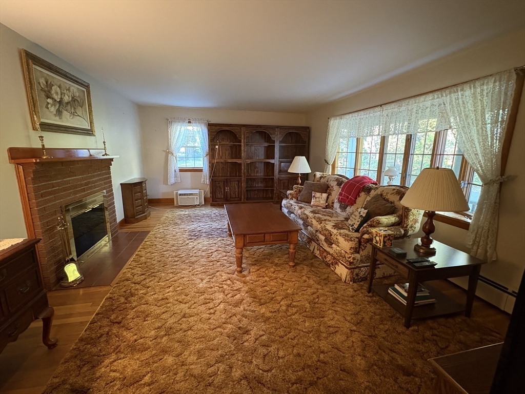 11 Highland Avenue Clinton, MA 01510 - Photo 3 of 25 a living room with furniture and a fireplace
