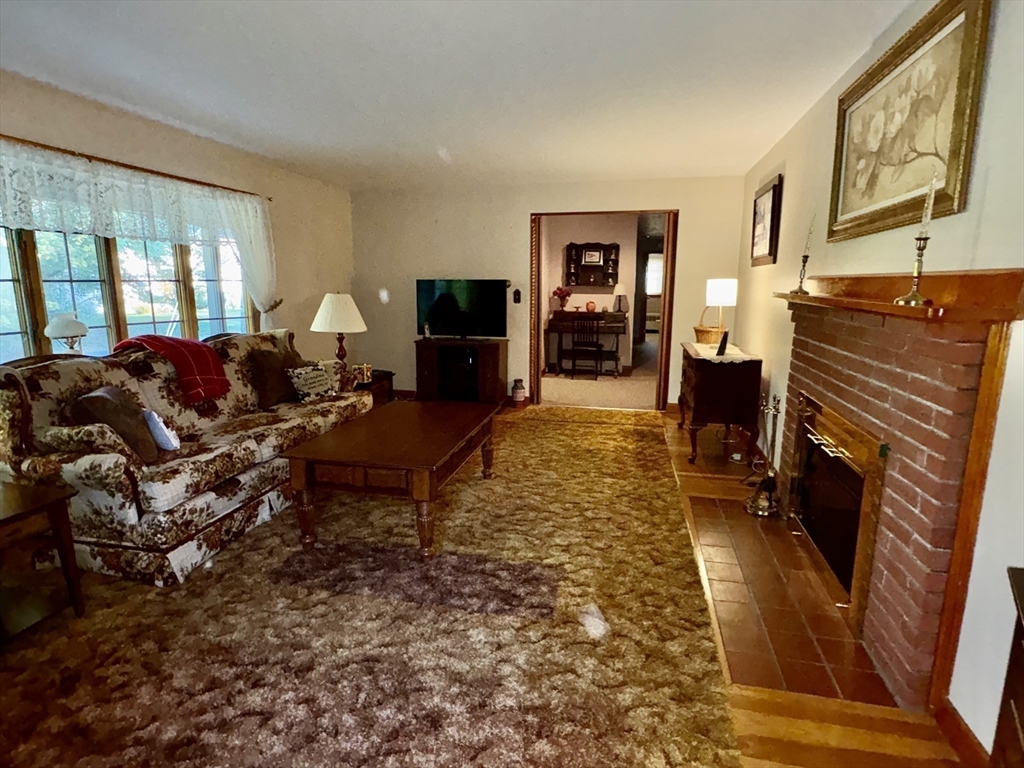 11 Highland Avenue Clinton, MA 01510 - Photo 5 of 25 a living room with furniture a couch and large windows