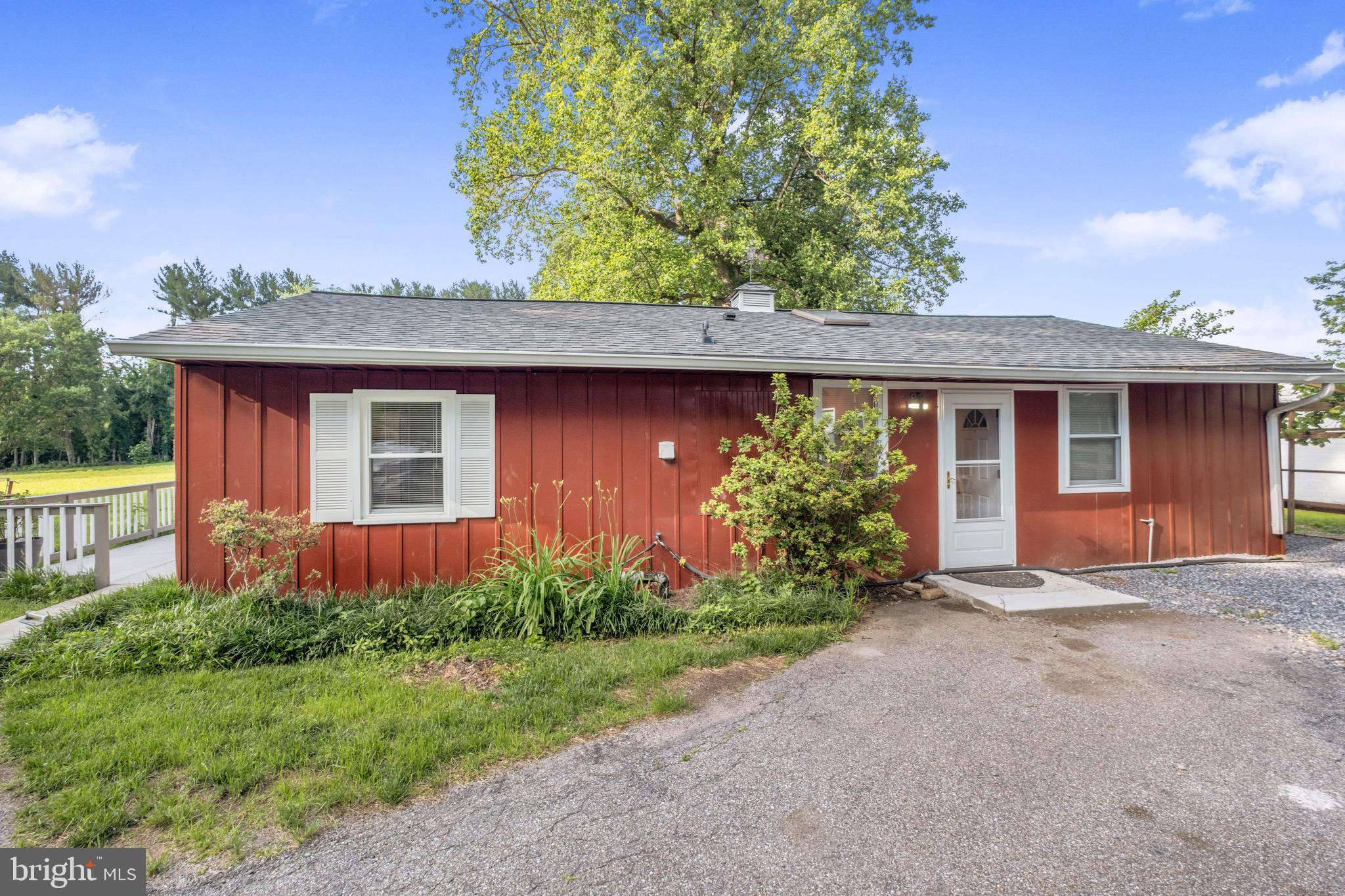 3304 Enterprise Road, Unit B Bowie, MD 20721 - Photo 1 of 8 a front view of a house with garden