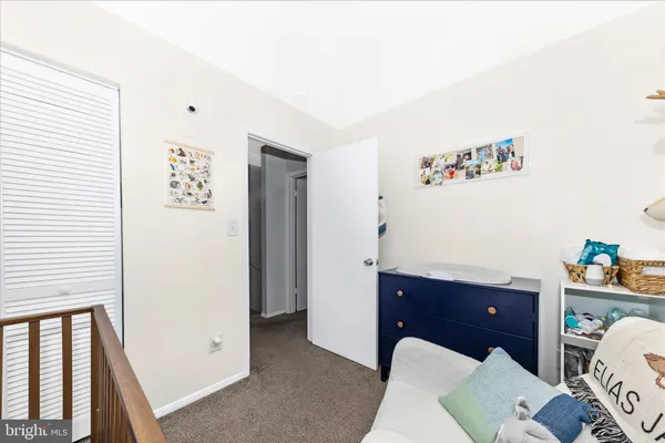 a view of living room with a baby crib