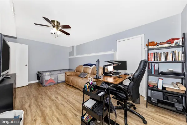 a bedroom with furniture and a book shelf