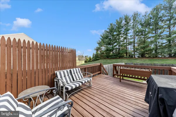a view of outdoor sitting area with furniture