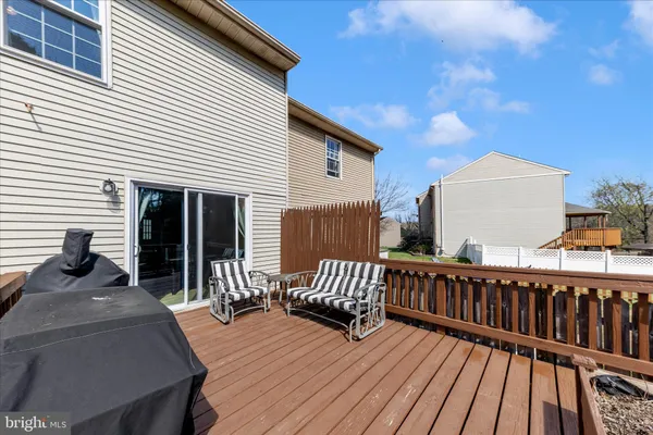a view of a house with wooden deck