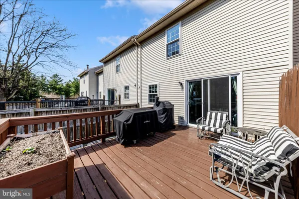 a view of a wooden deck with a bench