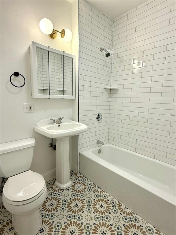 19 Howell Street, Unit 2 Boston, MA 02125 - Photo 15 of 16 a bathroom with a sink toilet and shower