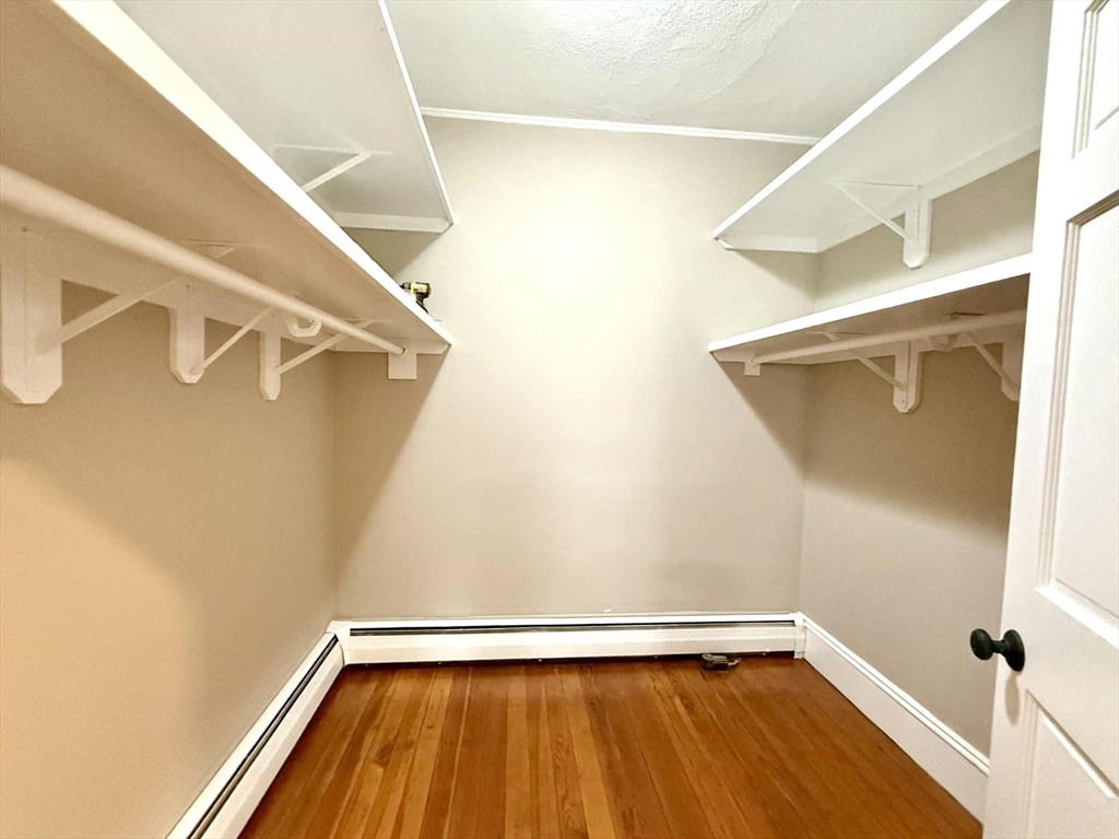 19 Howell Street, Unit 2 Boston, MA 02125 - Photo 10 of 16 a view of walk in closet with wooden floor